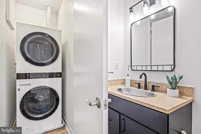 2412 17th St NW Unit 102, Washington, DC 20009 - bathroom featuring stacked washer / dryer and vanity