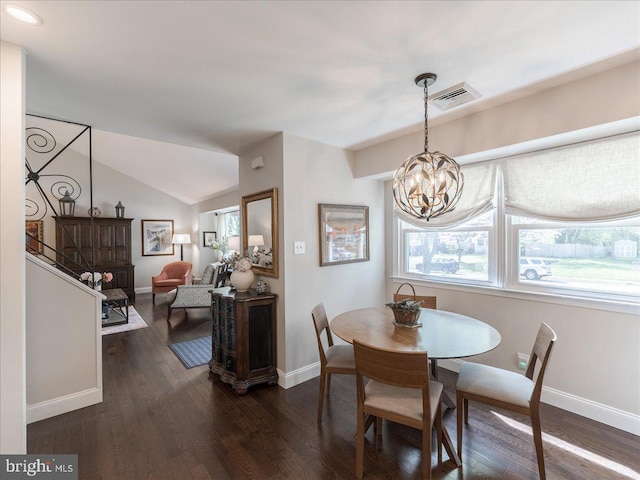 dining area featuring a chandelier, baseboards, dark wood-type flooring, and vaulted ceiling