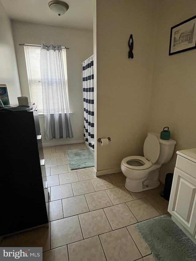 4010 Baring St, Philadelphia, PA 19104 - full bathroom featuring tile patterned floors, toilet, baseboards, and curtained shower