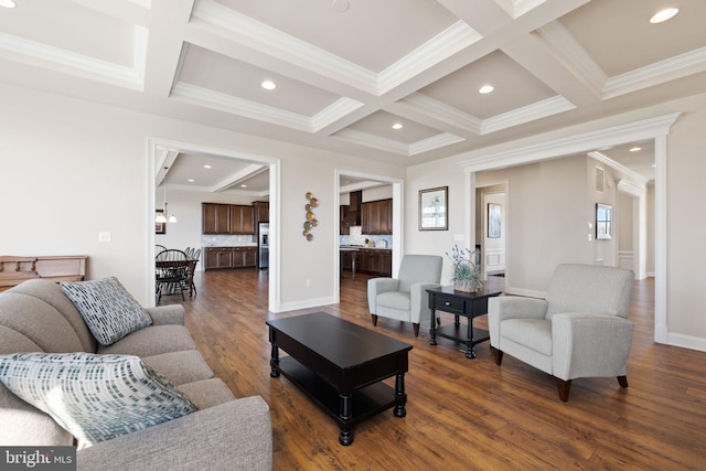 living area featuring dark wood finished floors, beam ceiling, and coffered ceiling