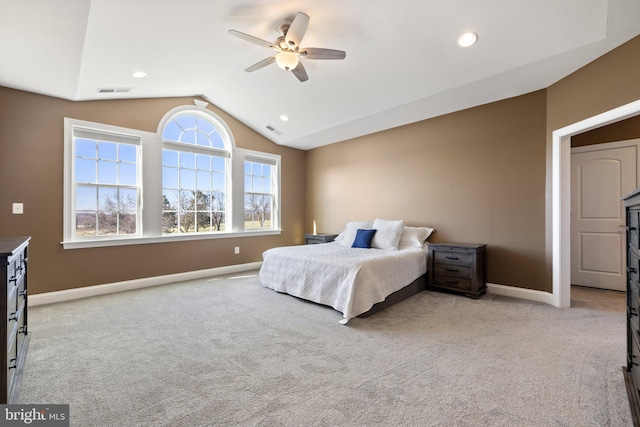 bedroom featuring baseboards, lofted ceiling, visible vents, and light colored carpet