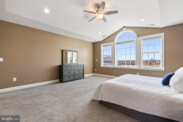 bedroom with baseboards, visible vents, carpet floors, and vaulted ceiling