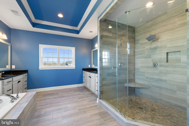 full bath with vanity, ornamental molding, baseboards, and a shower stall
