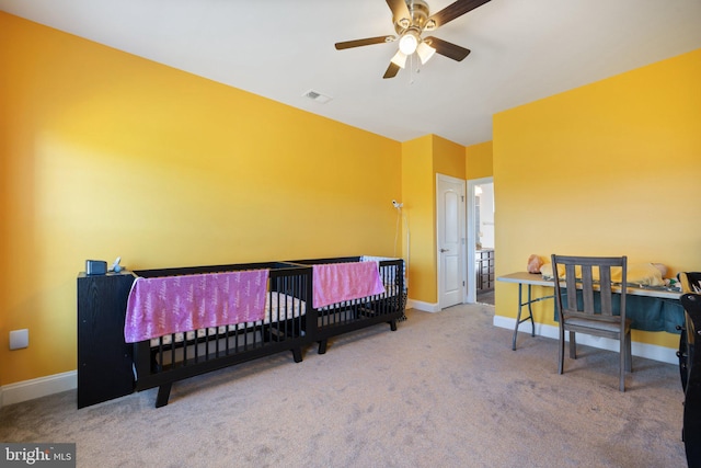 bedroom with baseboards, visible vents, and carpet flooring