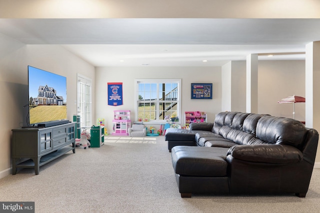 carpeted living area with baseboards and recessed lighting
