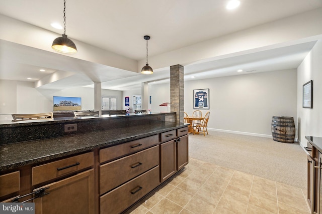kitchen featuring light carpet, baseboards, pendant lighting, and recessed lighting