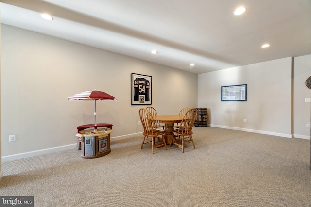 carpeted dining space with baseboards and recessed lighting