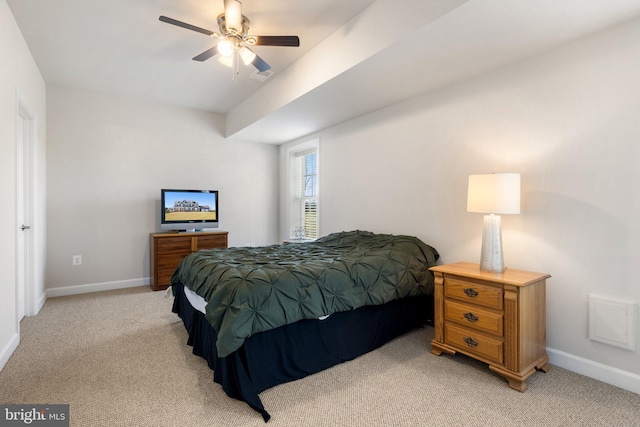 bedroom featuring baseboards, visible vents, a ceiling fan, and light carpet