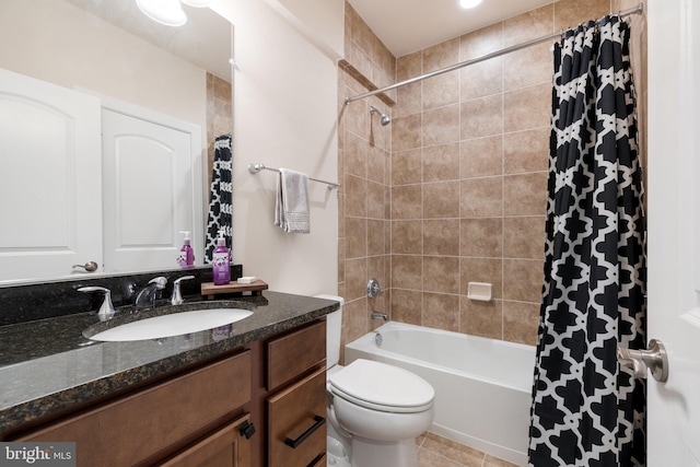 full bathroom with shower / tub combo, toilet, tile patterned flooring, and vanity