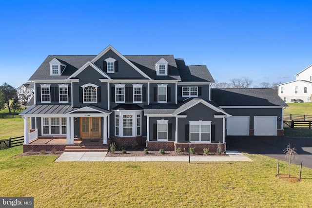 view of front of home with fence, a front lawn, and french doors