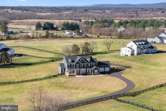 drone / aerial view with a mountain view and a rural view