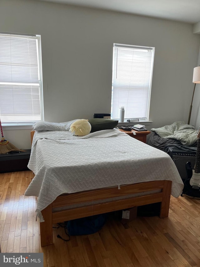 bedroom with wood finished floors