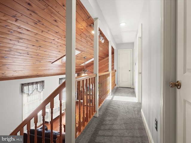 hall with carpet flooring, recessed lighting, baseboards, and wooden ceiling