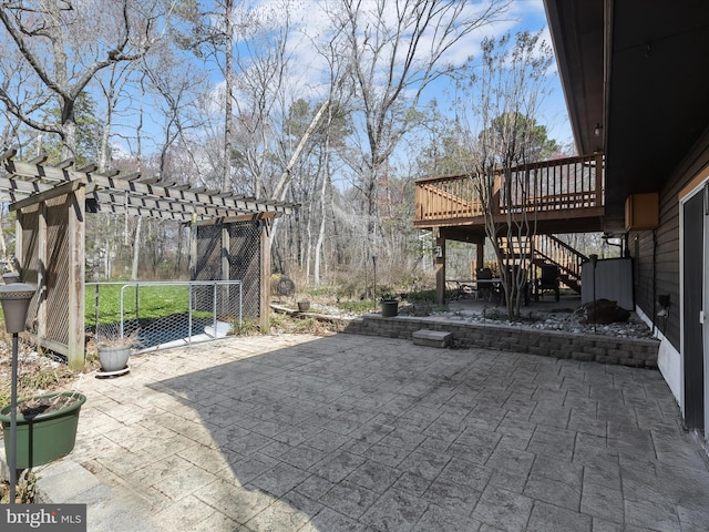 view of patio / terrace featuring a pergola, stairway, and a deck