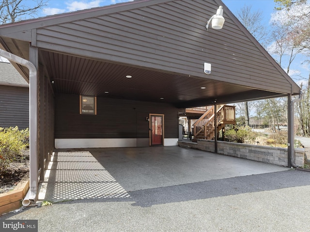 exterior space with stairs and an attached carport