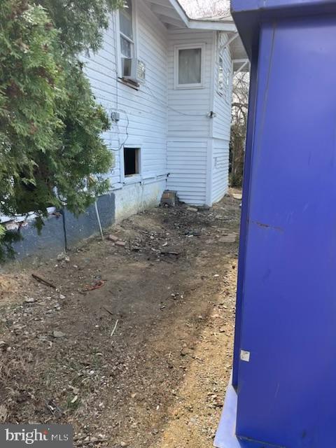 view of side of property featuring cooling unit