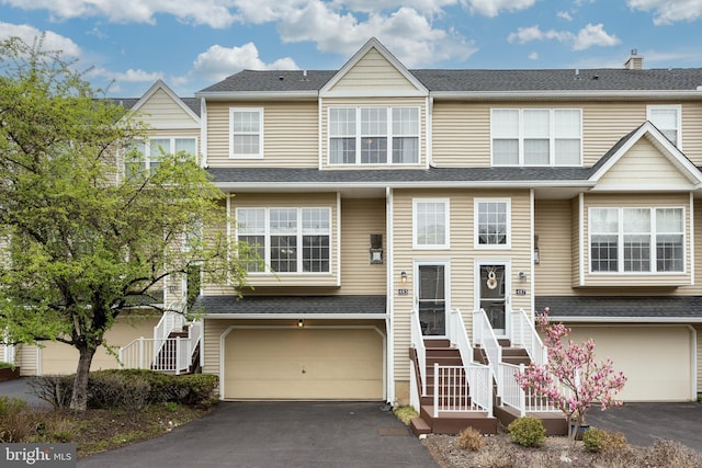 485 Lake George Cir, West Chester, PA 19382 - multi unit property with aphalt driveway, roof with shingles, and an attached garage