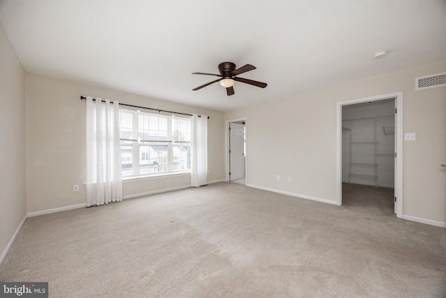 485 Lake George Cir, West Chester, PA 19382 - unfurnished bedroom featuring a walk in closet, visible vents, baseboards, and carpet