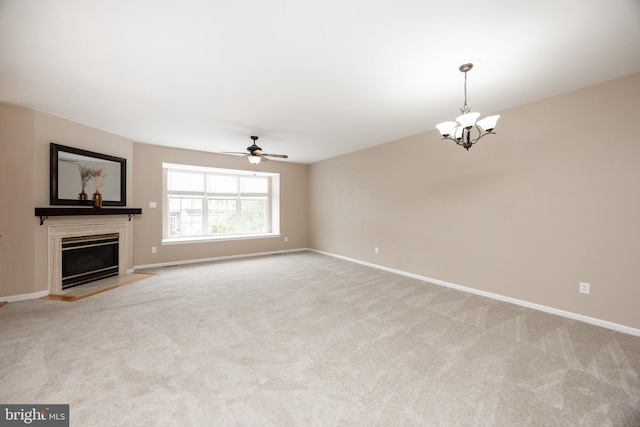 485 Lake George Cir, West Chester, PA 19382 - unfurnished living room with a glass covered fireplace, light colored carpet, ceiling fan with notable chandelier, and baseboards