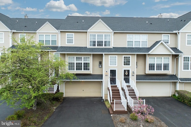 485 Lake George Cir, West Chester, PA 19382 - multi unit property with aphalt driveway, roof with shingles, stairs, and an attached garage
