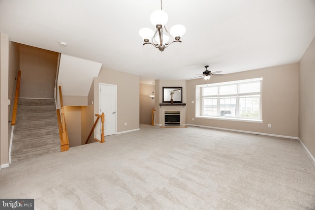 485 Lake George Cir, West Chester, PA 19382 - unfurnished living room featuring a fireplace with flush hearth, light carpet, ceiling fan with notable chandelier, and baseboards