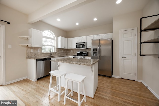 485 Lake George Cir, West Chester, PA 19382 - kitchen featuring tasteful backsplash, open shelves, white cabinets, light wood-style floors, and stainless steel appliances