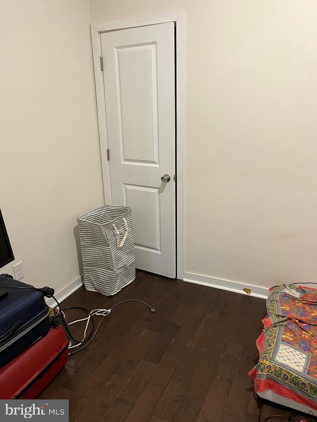 416 N Wiota St, Philadelphia, PA 19104 - bedroom with dark wood-style floors and baseboards