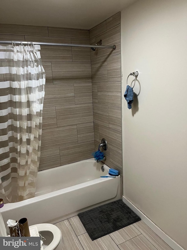 416 N Wiota St, Philadelphia, PA 19104 - bathroom featuring shower / bath combo with shower curtain and baseboards