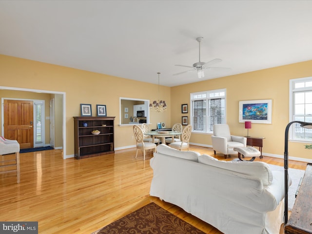 112 Daniel Ct, Strasburg, VA 22657 - living area with baseboards, ceiling fan, and light wood-style flooring