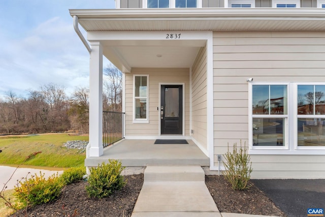 3065 Rambling Brook Ln, Crozet, VA 22932 - view of exterior entry featuring covered porch and a yard
