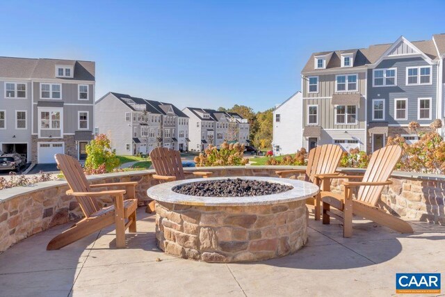 3065 Rambling Brook Ln, Crozet, VA 22932 - view of patio with an outdoor fire pit and a residential view