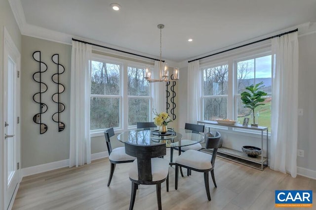 3065 Rambling Brook Ln, Crozet, VA 22932 - dining room with baseboards, light wood finished floors, a notable chandelier, and plenty of natural light