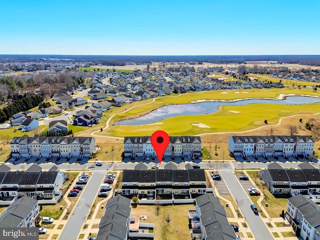 drone / aerial view featuring a water view and view of golf course