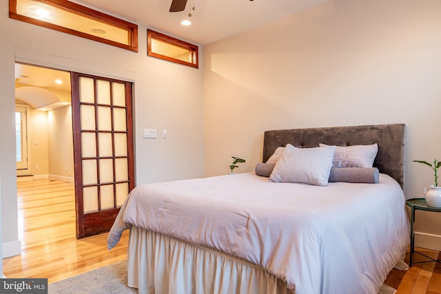 bedroom with ceiling fan, recessed lighting, and wood finished floors