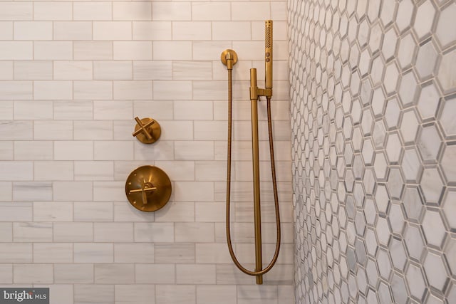 full bath with a tile shower