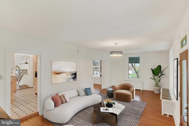 662 S Market St, Elizabethtown, PA 17022 - living area featuring radiator heating unit, light wood-style flooring, and baseboards