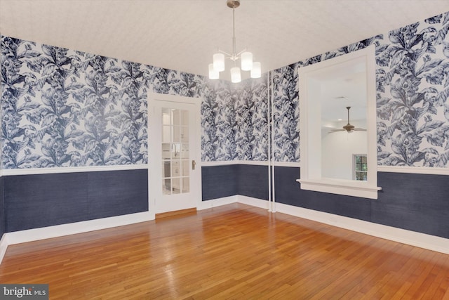 662 S Market St, Elizabethtown, PA 17022 - unfurnished room featuring wallpapered walls, hardwood / wood-style floors, a wainscoted wall, baseboards, and a chandelier