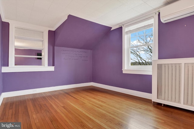 662 S Market St, Elizabethtown, PA 17022 - bonus room with a wall mounted air conditioner, wood-type flooring, built in features, baseboards, and vaulted ceiling
