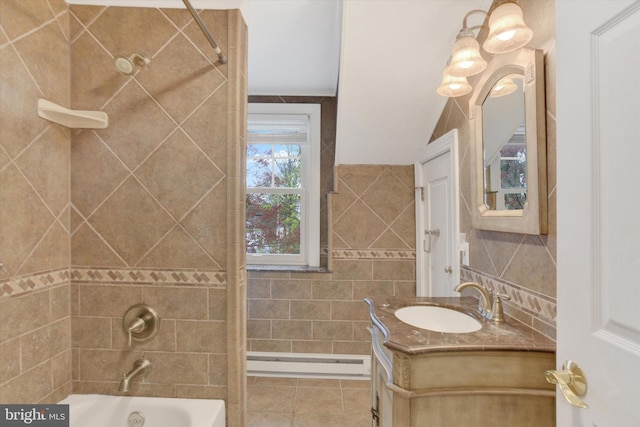 662 S Market St, Elizabethtown, PA 17022 - bathroom featuring baseboard heating, vanity, shower / tub combination, tile patterned floors, and tile walls