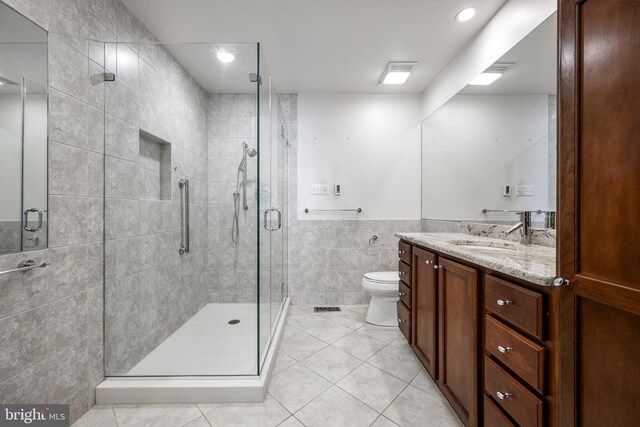 550 E Saxony Dr Unit 550, Exton, PA 19341 - full bath with tile walls, tile patterned flooring, vanity, a stall shower, and toilet