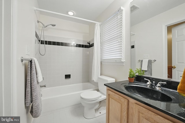 full bath with vanity, tile patterned flooring, toilet, visible vents, and tub / shower combination