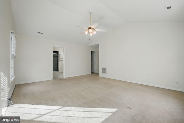 spare room featuring light carpet, visible vents, baseboards, and a ceiling fan