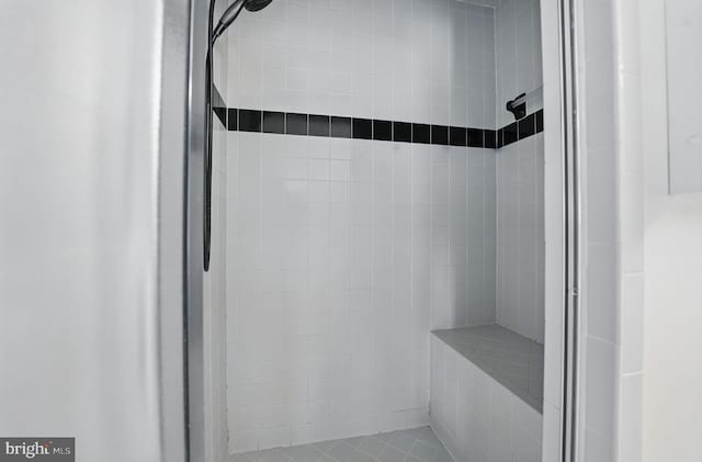 bathroom with tiled shower
