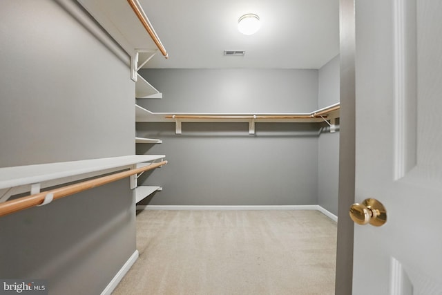 spacious closet with carpet and visible vents