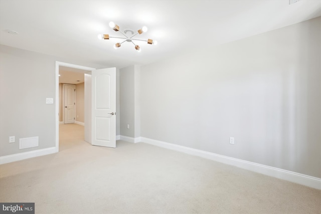 329 15th St NE, Washington, DC 20002 - spare room featuring light colored carpet, a chandelier, and baseboards