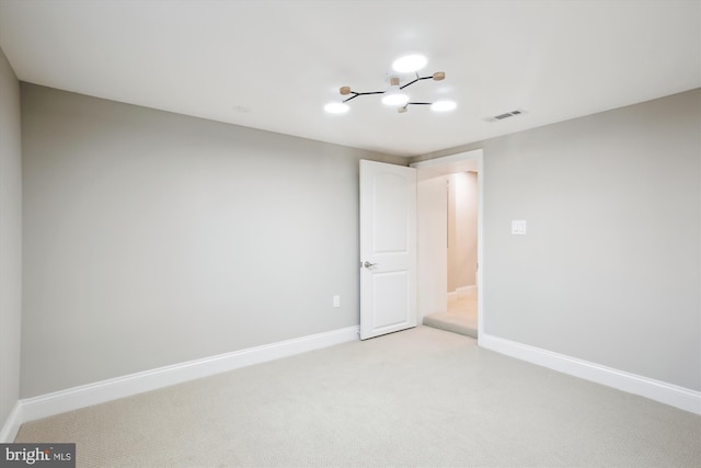 329 15th St NE, Washington, DC 20002 - empty room with a chandelier, light colored carpet, and baseboards