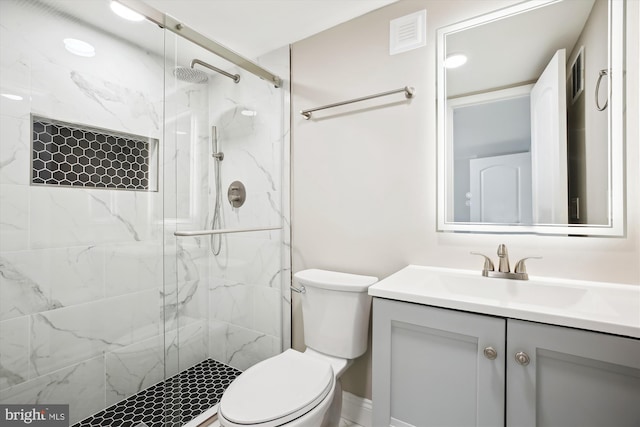 329 15th St NE, Washington, DC 20002 - bathroom featuring toilet, a marble finish shower, and vanity