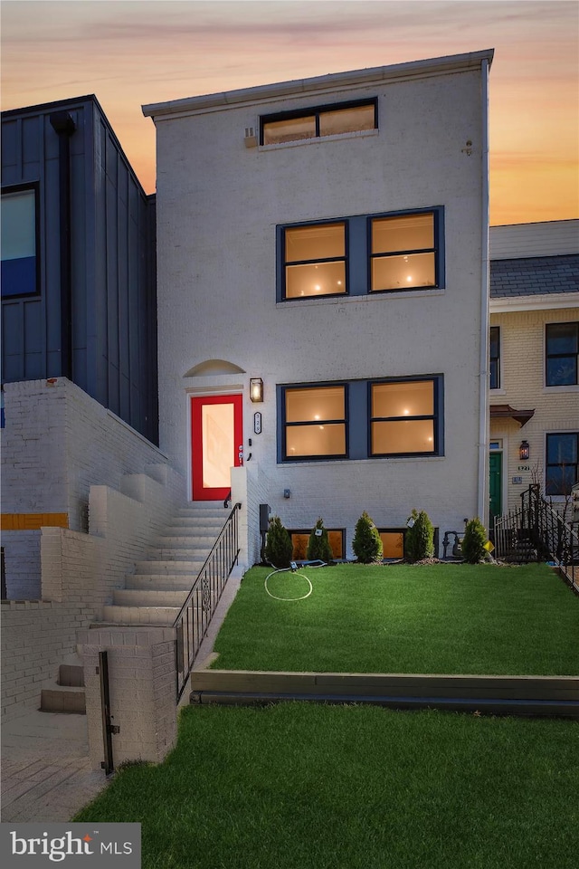 329 15th St NE, Washington, DC 20002 - view of front of property featuring a front lawn and stucco siding
