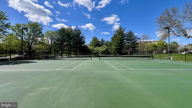 view of sport court with fence