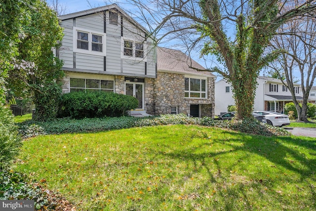 1057 Fitzwatertown Rd, Roslyn, PA 19001 - view of front facade featuring stone siding and a front lawn